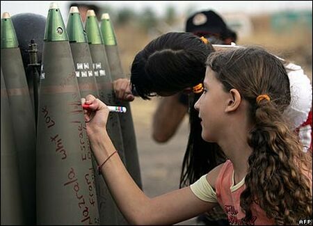 Israeli children signing missiles